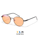 Lunettes gaming anti lumière bleue rondes en métal noir avec verres ambrés et plaquettes de nez sur fond blanc